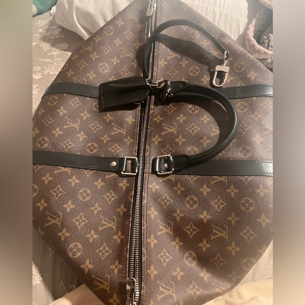 Louis Vuitton duffel bag large authentic fairly new worn twice